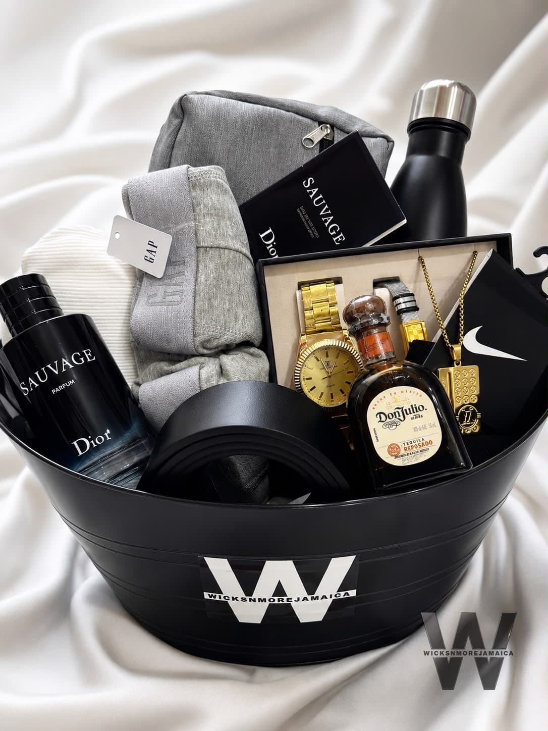 A luxury black gift set with Dior Sauvage, a gold watch set and premium spirits